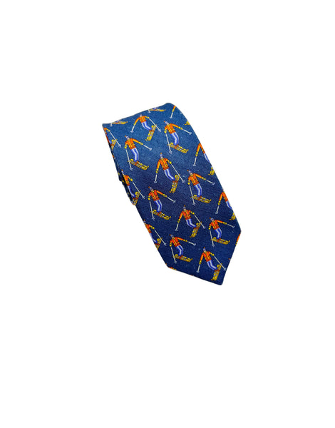 A blue necktie with a repeating pattern of skiers in orange and light blue, displayed on a clean white background.